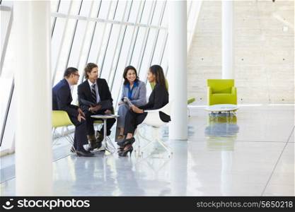 Businesspeople Having Meeting In Modern Office
