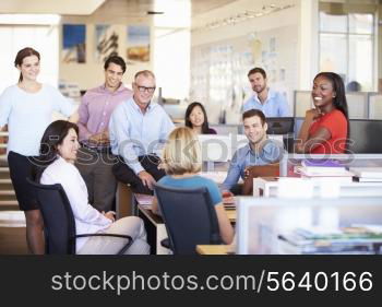 Businesspeople Having Meeting In Modern Open Plan Office