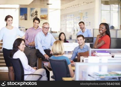 Businesspeople Having Meeting In Modern Open Plan Office