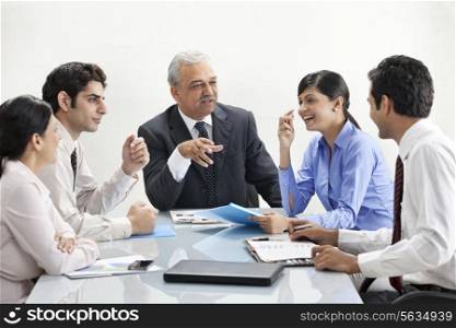 Businesspeople in happy discussion together