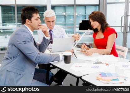 Businesspeople in office having discussion. Working as a team