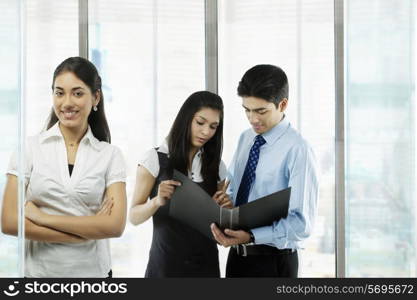 Businesspeople looking at a file