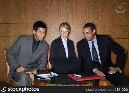 Businesspeople Looking at Laptop