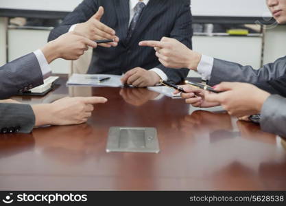 Businesspeople Making Gestures During Business Meeting