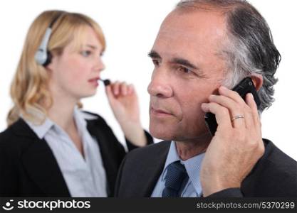 Businesspeople making phone calls