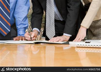 Businesspeople signing contract