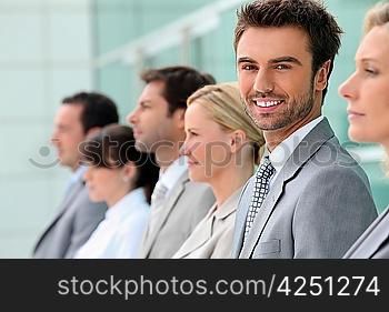 Businesspeople stood in a row