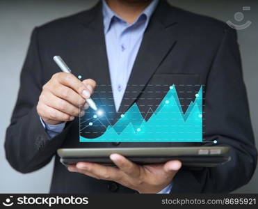 businesspeople using a tablet to view company financial reports, and graphics showing financial and numerical growth data. The concept of financial management is to grow and be profitable.