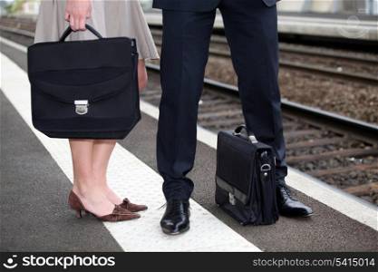 Businesspeople waiting at the trainstation