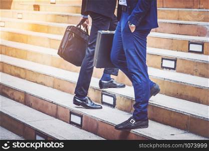 businesspeople walking at city