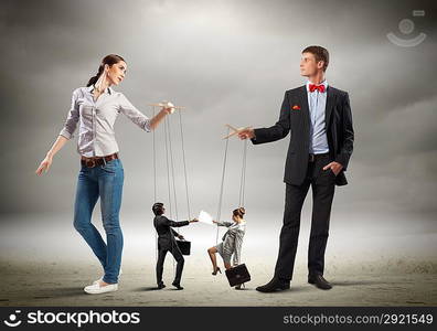 Businesspeople with marionettes