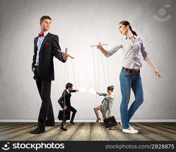 Businesspeople with marionettes