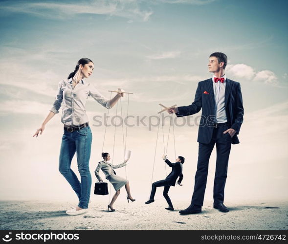 Businesspeople with marionettes. Image of man and woman with marionette puppets