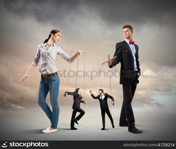 Businesspeople with marionettes. Image of man and woman with marionette puppets