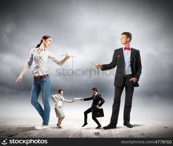 Businesspeople with marionettes. Image of man and woman with marionette puppets