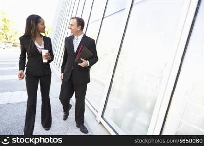 Businesspeople With Takeaway Coffee Outside Office