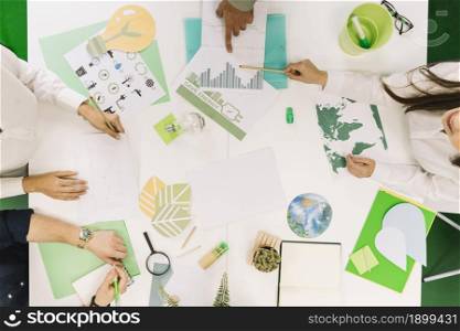 businesspeople working graph with various natural resources icon desk. Resolution and high quality beautiful photo. businesspeople working graph with various natural resources icon desk. High quality beautiful photo concept