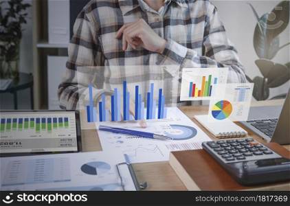 Businesspeople working in finance and accounting Analyze financial graph budget and planning for future in office room.