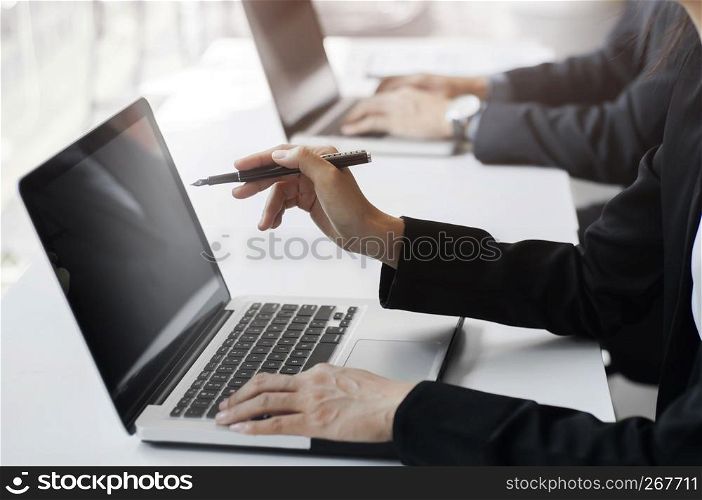 businesspeople working, using computer laptop, group discussing solution