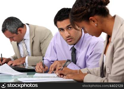 Businesspeople writing notes