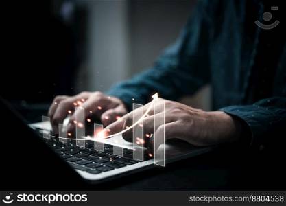 Businessperson using laptop computer with chart. business investment and financial concept of growth economic. Investor data analysis for planning in strategy of stock market fund.