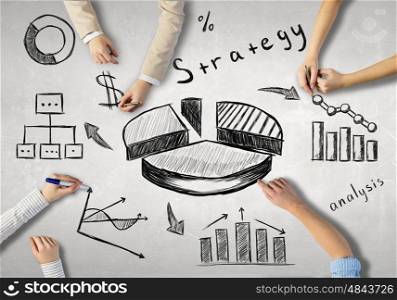 Businessteam working in collaboration. Top view of people hands drawing business strategy successful plan