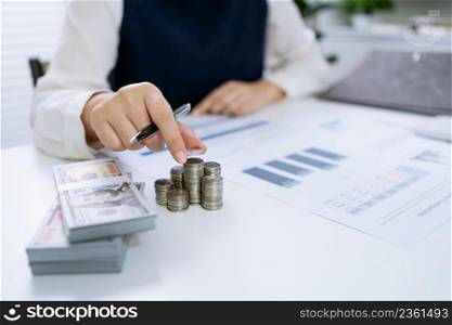 Businesswoman Accountant analyzing investment charts Invoice and pressing calculator buttons over documents. Accounting Bookkeeper ClerkBank Advisor And Auditor Concept.