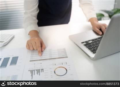 Businesswoman Accountant analyzing investment charts Invoice and pressing calculator buttons over documents. Accounting Bookkeeper Clerk Bank Advisor And Auditor Concept.