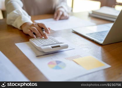 Businesswoman Accountant analyzing investment charts Invoice and pressing calculator buttons over documents. Accounting Bookkeeper Clerk Bank Advisor And Auditor 