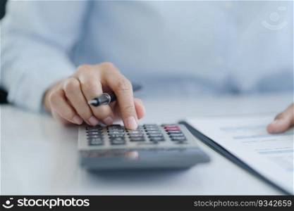 Businesswoman Accountant analyzing investment charts Invoice and pressing calculator buttons over documents. Accounting Bookkeeper Clerk Bank Advisor And Auditor.