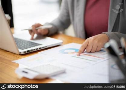 Businesswoman Accountant analyzing investment charts Invoice and pressing calculator buttons over documents. Accounting Bookkeeper Clerk Bank Advisor And Auditor Concept.