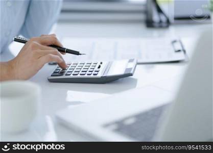 Businesswoman Accountant analyzing investment charts Invoice and pressing calculator buttons over documents. Accounting Bookkeeper Clerk Bank Advisor And Auditor.