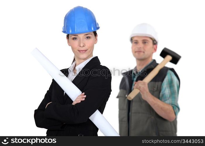 businesswoman and craftsman posing together