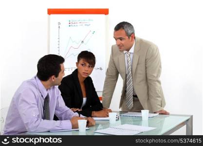 businesswoman and male colleagues at meeting