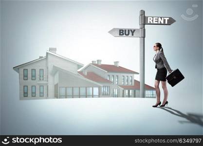 Businesswoman at crossroads betweem buying and renting