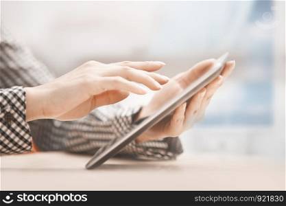 Businesswoman at office working with digital tablet