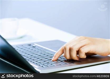 Businesswoman at work. Close up image of businesswoman hands typing on keyboard
