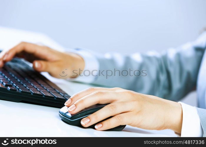 Businesswoman at work. Close up image of businesswoman hands typing on keyboard