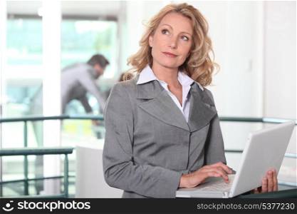 businesswoman at workplace with laptop