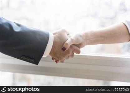 businesswoman businessman shaking hands
