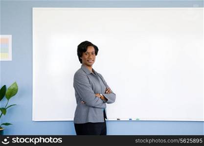 Businesswoman by whiteboard
