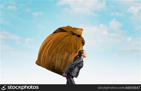 Businesswoman carrying big heavy bag on back. Delivery is our work