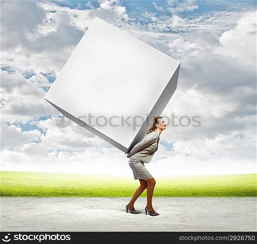 Businesswoman carrying cube