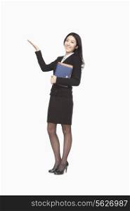 Businesswoman carrying files with raised hand