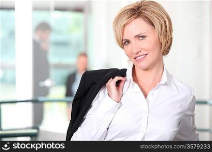 Businesswoman carrying her jacket over her shoulder