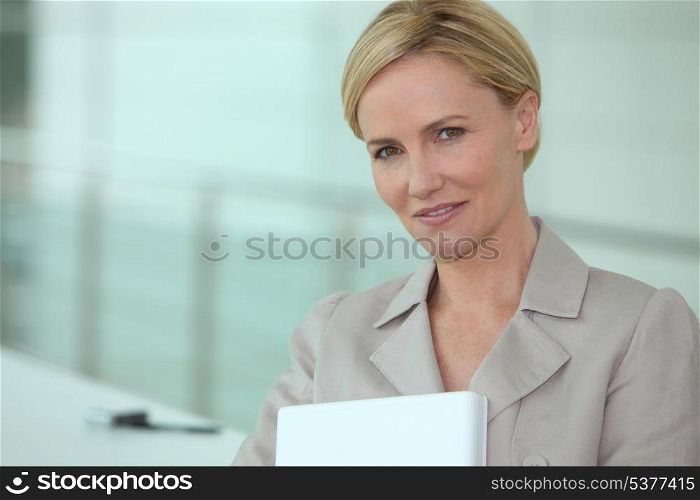 Businesswoman carrying laptop