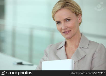 Businesswoman carrying laptop