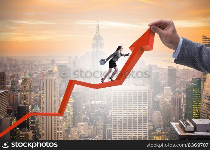 Businesswoman climbing line chart in economic recovery concept
