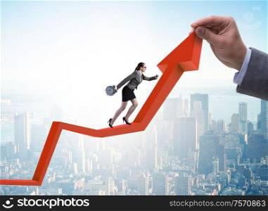 Businesswoman climbing line chart in economic recovery concept. The businesswoman climbing line chart in economic recovery conce