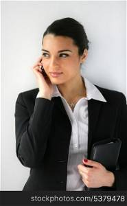 Businesswoman clutching diary